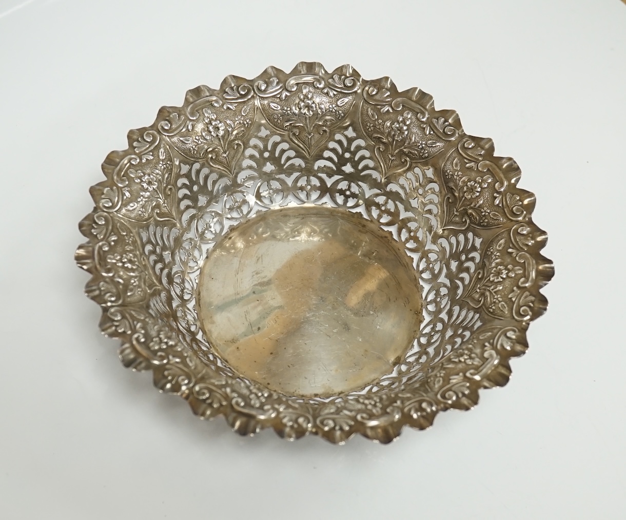 A late Victorian pierced silver bonbon dish, Atkin Brothers, Sheffield, 1895, diameter 16.2cm, a similar repousse silver bowl, London, 1895, a silver purse, an Israeli? sterling two handled vase, stamped Kevork, gross 16